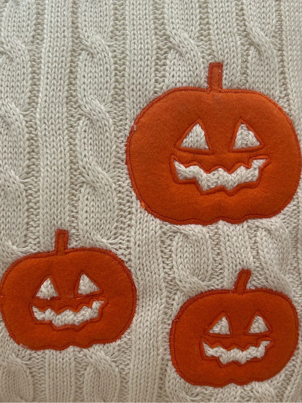 “New” Cupcakes & Cashmere Cream Cable-Knit Pillow with Orange Jack-o'-Lanterns